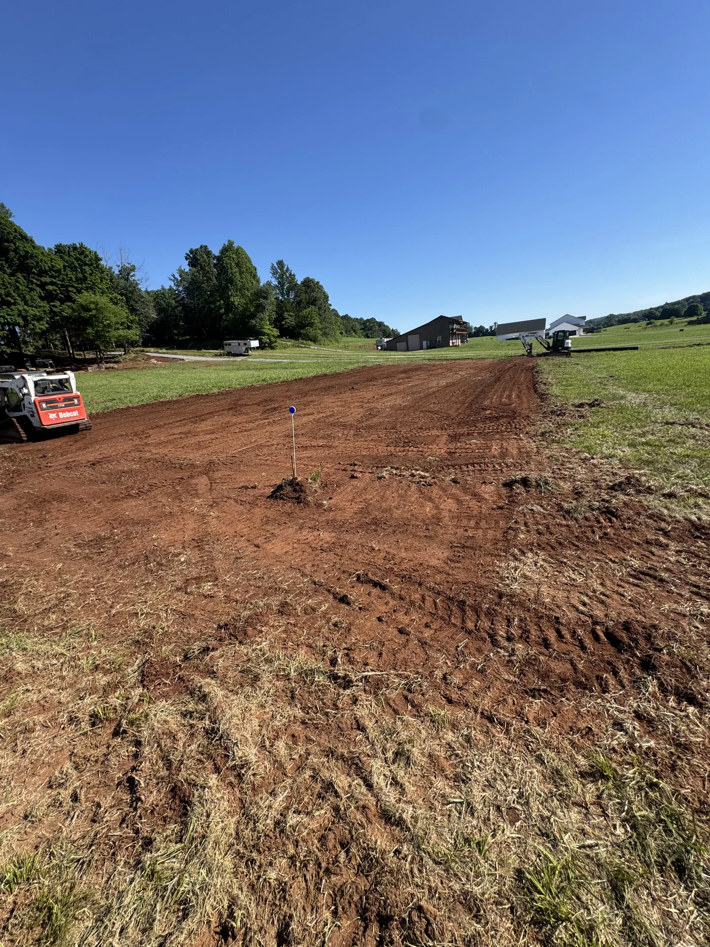 A broad area of freshly graded soil ready for the next stage.
